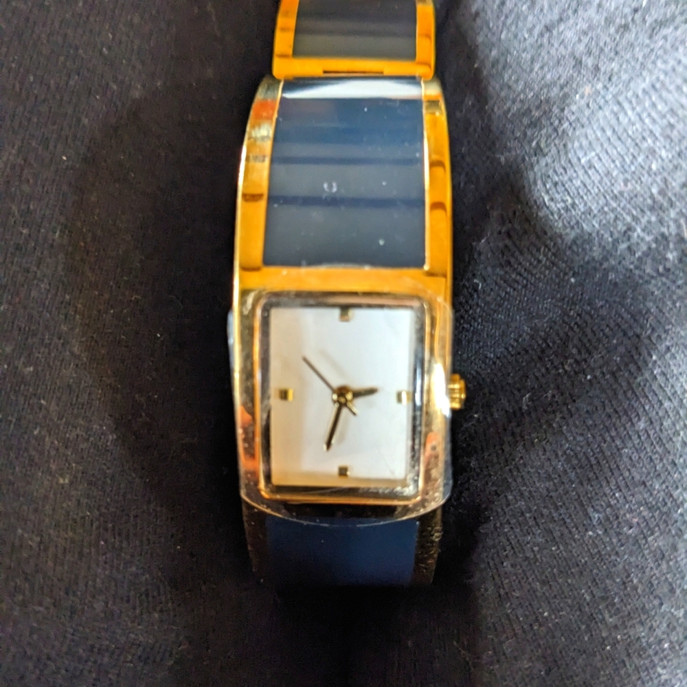 Estee Lauder bangle Cuff Watch...Black And Gold